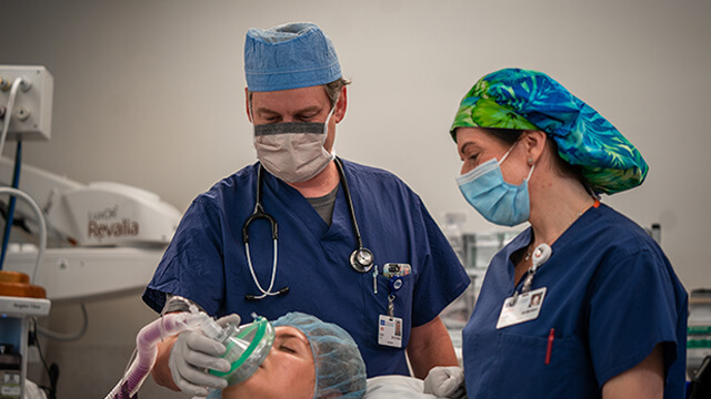 2 Anesthesiologists with patient